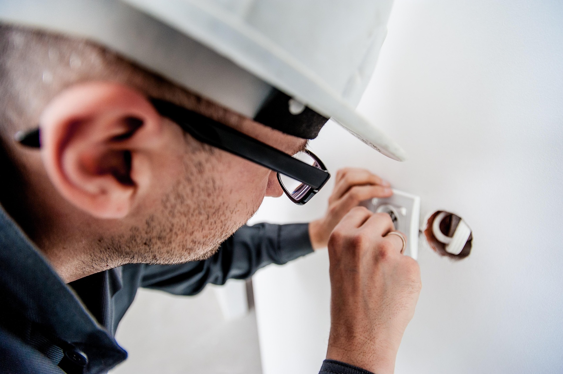 Licensed electrician working on power point